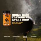 A jar of Fynn The Wingman Chicken Rub seasoning is shown next to a black grill with smoke rising in an outdoor setting, with bold text reading 'BRING BOLD FLAVOUR TO EVERY BIRD'.