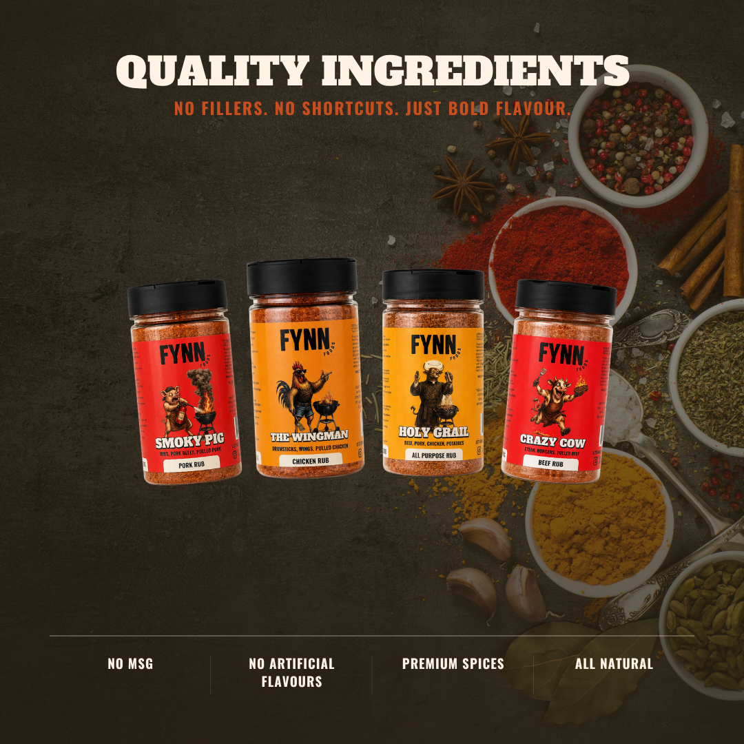 Four jars of Fynn brand spices arranged in a row against a dark textured background with spice ingredients like cinnamon, garlic, peppercorns, and turmeric shown around them. Text at the top reads 'QUALITY INGREDIENTS' and the jars have red and orange labels.