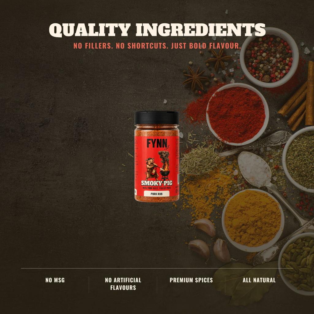 A jar of Fynn Smoky Pig smoked meat seasoning is centered on a dark textured background, surrounded by bowls of colorful spices, star anise, cinnamon sticks, garlic cloves, and a spoon. Text at the top reads 'QUALITY INGREDIENTS' and the bottom text highlights 'NO MSG', 'NO ARTIFICIAL FLAVOURS', 'PREMIUM SPICES', and 'ALL NATURAL'.