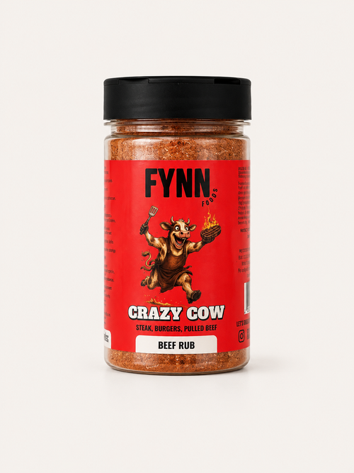A bottle of Fynn's Crazy Cow Beef Rub seasoning, featuring a red label with a cartoon cow illustration and a black lid, set against a plain light background.