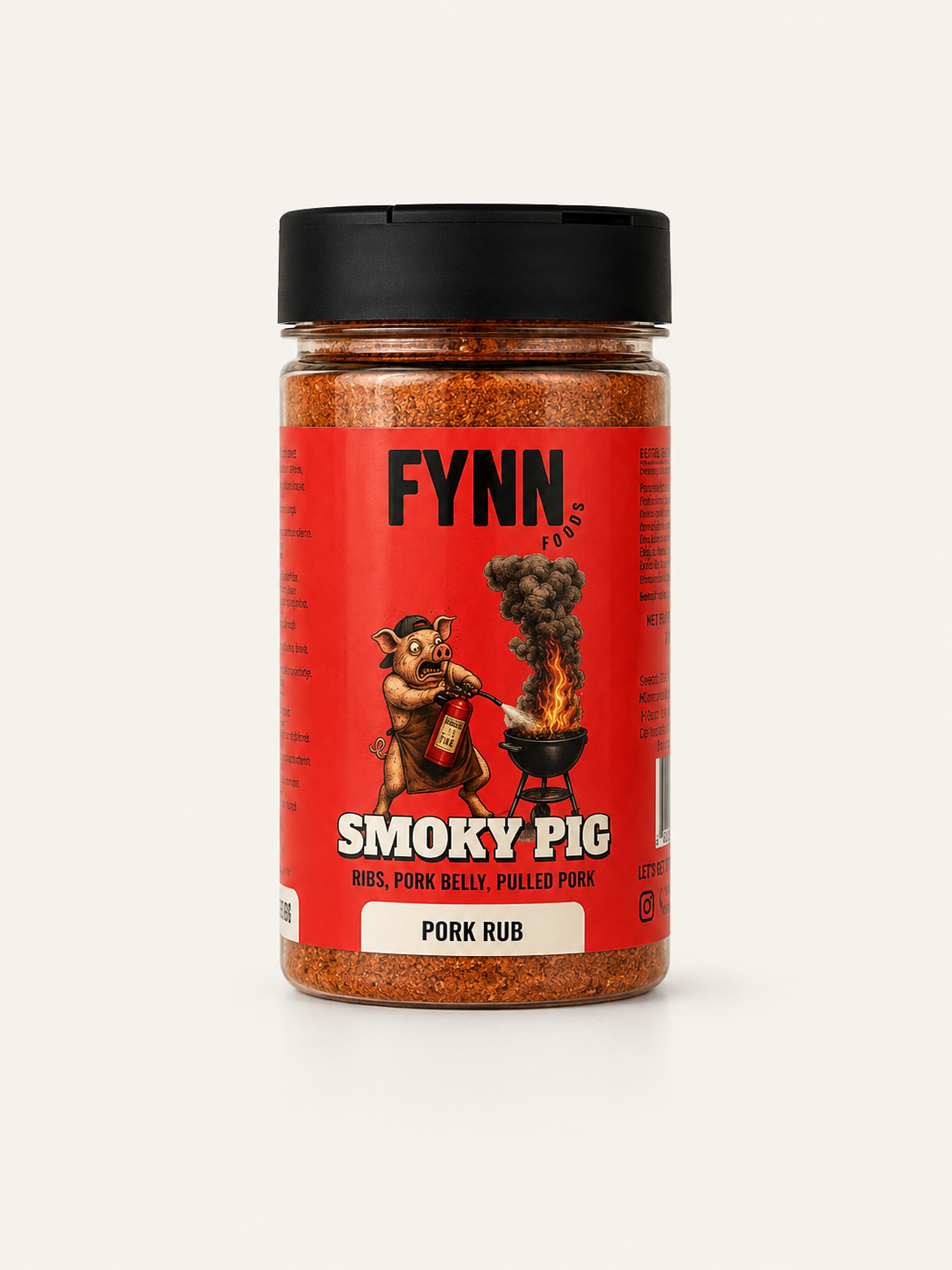A bottle of Fynn Smoky Pig Pork Rub seasoning, featuring a red label with a cartoon pig grilling and a black lid, set against a plain light background.