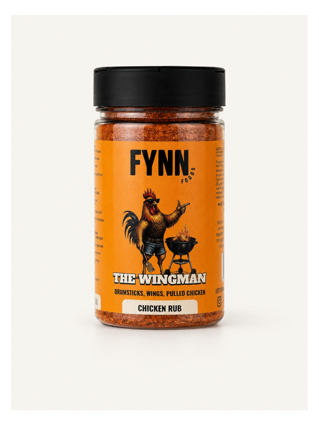 A jar of Fynn Foods 'The Wingman' Chicken Rub spice rub, featuring an orange label with a rooster graphic and a black lid, set against a plain off-white background.